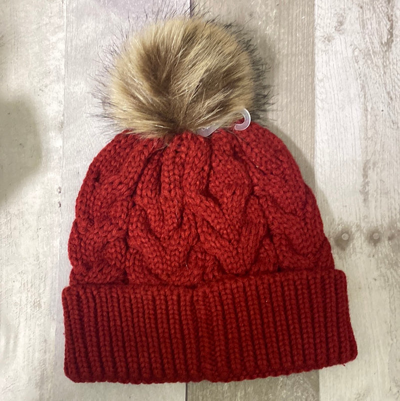 Colorful knit stocking caps with fur puff ball