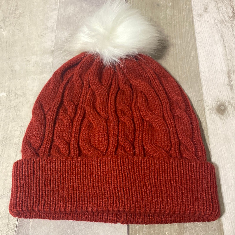Colorful knit stocking caps with fur puff ball